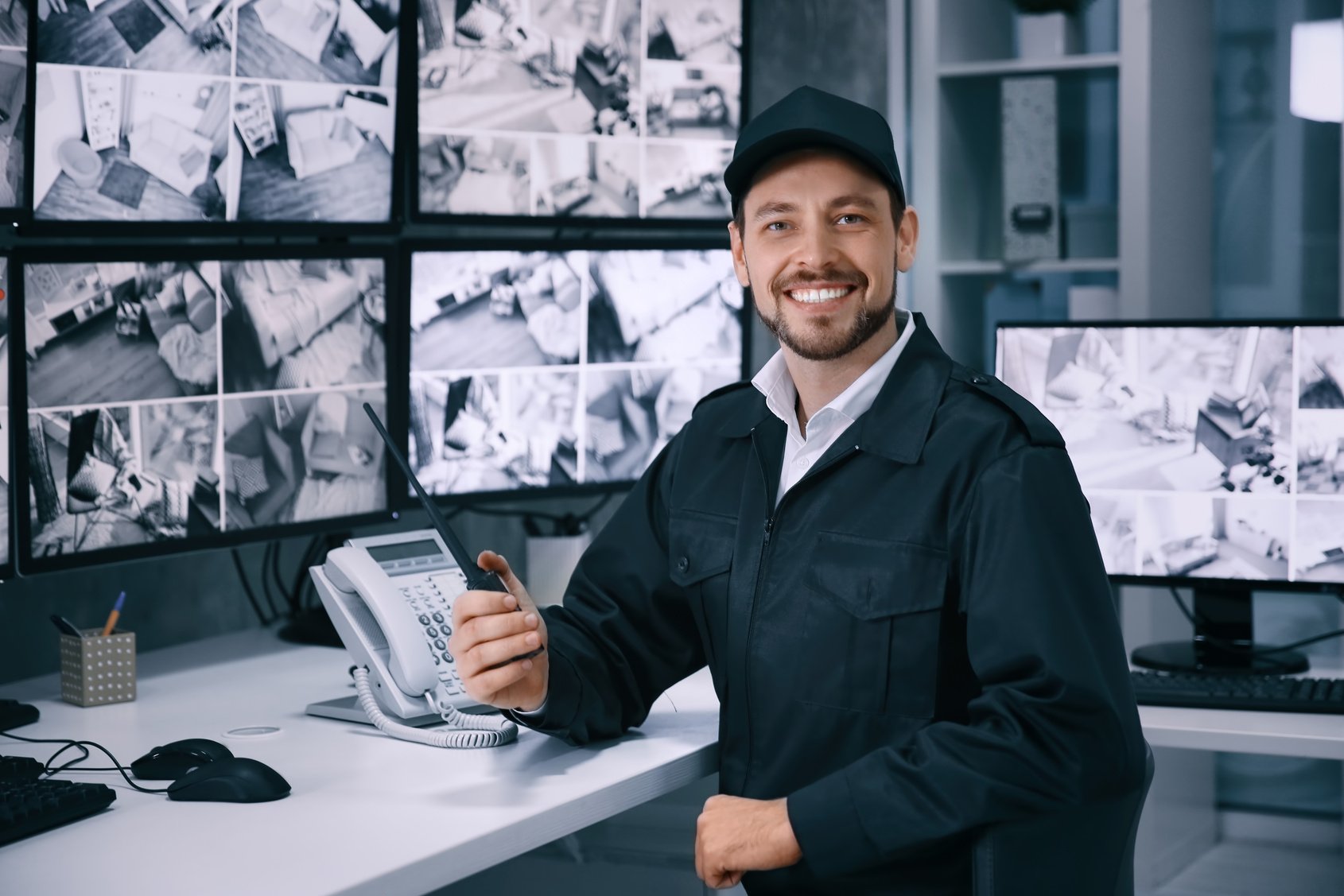 Male Security Guard Working in Surveillance Room